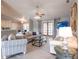 Bright living room with tile flooring, comfortable seating, and an open view to the kitchen and dining area at 2125 Floribanna St, North Port, FL 34287
