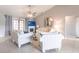 Cozy living room featuring a fireplace, tile floors, comfortable seating, and lots of natural light at 2125 Floribanna St, North Port, FL 34287