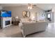 Bright living room with a fireplace, tv, tile flooring, and a door leading to the patio at 2125 Floribanna St, North Port, FL 34287