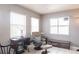 Well-lit living room with comfortable seating and natural lighting at 2125 Floribanna St, North Port, FL 34287