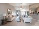 Open living room with vaulted ceilings, tile floors, and a seamless transition to the kitchen and dining spaces at 2125 Floribanna St, North Port, FL 34287