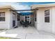 Covered outdoor patio with dining set and modern architectural design at 2125 Floribanna St, North Port, FL 34287