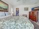 Bedroom featuring a king-size bed, closet, and flat screen tv at 237 Rotonda E Blvd, Rotonda West, FL 33947
