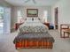 Bedroom showcasing a king-size bed, shuttered windows, and closet at 237 Rotonda E Blvd, Rotonda West, FL 33947