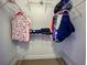 Walk-in closet provides ample storage space with built-in shelving and hanging rods at 237 Rotonda E Blvd, Rotonda West, FL 33947