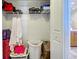 Walk-in closet provides ample storage with built-in shelving, and it's conveniently located next to the bathroom at 237 Rotonda E Blvd, Rotonda West, FL 33947