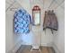 Walk-in closet with metal shelving and organized clothing at 237 Rotonda E Blvd, Rotonda West, FL 33947