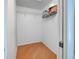 Empty walk-in closet with wooden floors and metal shelving at 237 Rotonda E Blvd, Rotonda West, FL 33947