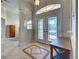 Inviting entryway featuring decorative glass doors and tile flooring with an eye-catching geometric design at 237 Rotonda E Blvd, Rotonda West, FL 33947