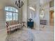 Elegant foyer featuring a decorative rug, comfortable seating, and plenty of natural light at 237 Rotonda E Blvd, Rotonda West, FL 33947
