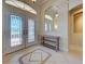 The front entrance features double doors with decorative glass, a tile floor, and furniture at 237 Rotonda E Blvd, Rotonda West, FL 33947