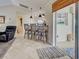 Bright kitchen featuring a breakfast bar with three stools and pendant lighting at 237 Rotonda E Blvd, Rotonda West, FL 33947