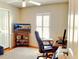 Cozy home office with natural light from shuttered window and featuring a comfortable executive-style desk chair at 237 Rotonda E Blvd, Rotonda West, FL 33947