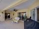 Spacious covered patio area with ceiling fan, ideal for outdoor dining and grilling at 237 Rotonda E Blvd, Rotonda West, FL 33947