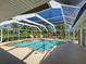 Inviting screened-in pool with seating area, perfect for enjoying the outdoors in comfort and style at 237 Rotonda E Blvd, Rotonda West, FL 33947