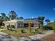 A screened pool area is surrounded by lush greenery at 237 Rotonda E Blvd, Rotonda West, FL 33947