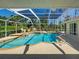 Refreshing screened-in pool area, perfect for relaxation and outdoor entertainment with lush landscaping at 237 Rotonda E Blvd, Rotonda West, FL 33947