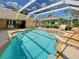 Relaxing screened-in pool and patio area provides a perfect outdoor retreat with ample space for activities at 237 Rotonda E Blvd, Rotonda West, FL 33947