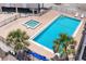 Community pool and spa with palm trees, Gulf views and lush landscape at 2700 N Beach Rd # A201, Englewood, FL 34223