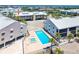 Aerial view of community pool, spa, buildings and surrounding landscape at 2700 N Beach Rd # A201, Englewood, FL 34223