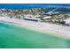 Beautiful aerial view of beachfront condos along pristine white sand beach and calm turquoise water at 2700 N Beach Rd # A201, Englewood, FL 34223