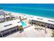 Overhead view of community pool, spa, beach, and Gulf at 2700 N Beach Rd # A201, Englewood, FL 34223