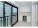 Wet bar off the hallway with a wine fridge and marble countertops at 2700 N Beach Rd # A201, Englewood, FL 34223