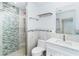 Contemporary bathroom with glass door shower adorned with blue mosaic tiles and granite countertop at 2700 N Beach Rd # A201, Englewood, FL 34223