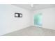 Clean and bright bedroom with minimalist design and updated flooring at 2700 N Beach Rd # A201, Englewood, FL 34223