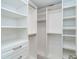 Bright walk-in closet features custom shelves and drawer space at 2700 N Beach Rd # A201, Englewood, FL 34223