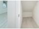 Well-lit walk in closet providing a tidy space for organizing belongings and keeping a clean aesthetic at 2700 N Beach Rd # A201, Englewood, FL 34223