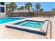 Community spa with view of pool and surrounding landscape at 2700 N Beach Rd # A201, Englewood, FL 34223