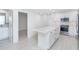 Modern kitchen featuring island, stainless steel appliances, and white cabinets at 2700 N Beach Rd # A201, Englewood, FL 34223