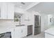 Modern kitchen with stainless steel appliances, white cabinetry and elegant countertops at 2700 N Beach Rd # A201, Englewood, FL 34223