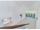 The open floor plan features a view of the staircase from above at 2700 N Beach Rd # A201, Englewood, FL 34223
