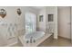 Bathroom showcasing a soaking tub, natural light, and modern fixtures at 29 Tournament Rd, Rotonda West, FL 33947