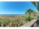 Balcony view showcasing direct access to the sandy beach and ocean waters at 29 Tournament Rd, Rotonda West, FL 33947