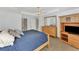 Bed with dresser and TV console; bright and roomy bedroom at 29 Tournament Rd, Rotonda West, FL 33947