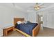Comfortable bedroom with large bed and views of the bathroom at 29 Tournament Rd, Rotonda West, FL 33947
