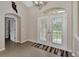 Inviting foyer with a view of a double-door entry, tile flooring, high ceilings, and natural light at 29 Tournament Rd, Rotonda West, FL 33947
