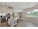 Bright eat-in kitchen featuring stainless steel appliances, granite countertops, and breakfast bar seating at 29 Tournament Rd, Rotonda West, FL 33947