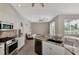 Open concept kitchen with granite countertops, stainless steel appliances, and a view to the living room at 29 Tournament Rd, Rotonda West, FL 33947