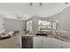 Stylish kitchen featuring granite countertops and stainless steel appliances with an open layout at 29 Tournament Rd, Rotonda West, FL 33947