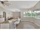 Modern kitchen featuring stainless steel appliances, breakfast bar and a view of outdoor space at 29 Tournament Rd, Rotonda West, FL 33947