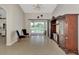 Expansive living room showcasing tile flooring, contemporary decor, and natural light from the outdoor patio at 29 Tournament Rd, Rotonda West, FL 33947