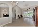Open-concept living space with tile flooring, elegant lighting, and easy access to outdoor amenities through sliding doors at 29 Tournament Rd, Rotonda West, FL 33947