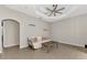 Cozy living room with tile floors, neutral walls and a comfortable couch and coffee table at 29 Tournament Rd, Rotonda West, FL 33947