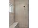 Shower with built-in bench and contemporary tile at 29 Tournament Rd, Rotonda West, FL 33947