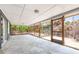 Enclosed patio featuring tiled ceiling, screened windows, and great views of backyard at 4065 N Beach Rd, Englewood, FL 34223