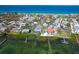 Gorgeous aerial view of a waterfront home situated near tranquil ocean waters and surrounding neighborhoods at 4093 Pelican Shores Cir, Englewood, FL 34223